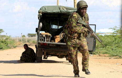 A Kenya Defence Force soldier runs for cover during al-Shabaab’s Garissa attack in April. The group is suspected of carrying out another atrocity in a village near the Somalia border.<br>