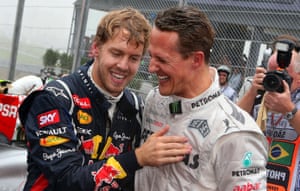 Sebastian Vettel is congratulated on his title by Michael Schumacher.