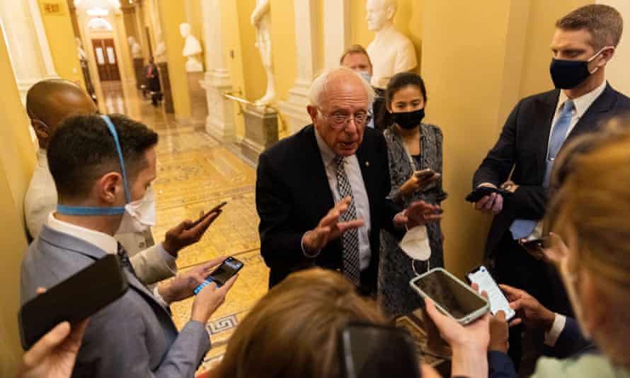 Bernie Sanders talks to reporters on Thursday as infrastructure negations continue in Washington DC.
