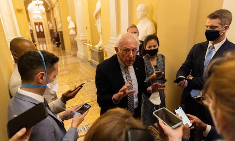 Senator Bernie Sanders talks to reporters on Thursday as infrastructure negations continue in Washington DC.