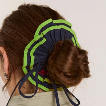 A model wears a large Damson Madder scrunchie over bun. The scrunchie is navy