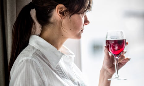 Woman holds a glass of wine