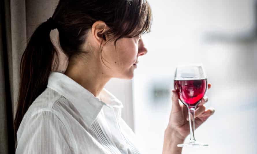 Woman drinking wine.