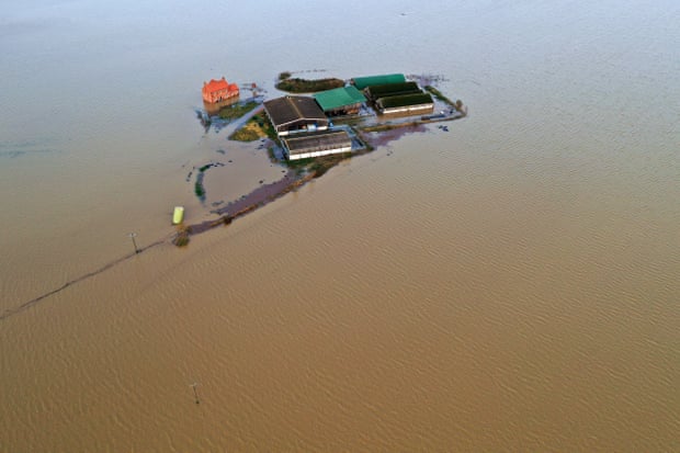 A farm in Bardney, near Lincoln, is marooned by flood water after the Barlings Eau broke its banks.