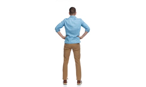 rear view of man dressed in blue shirt and chinos
