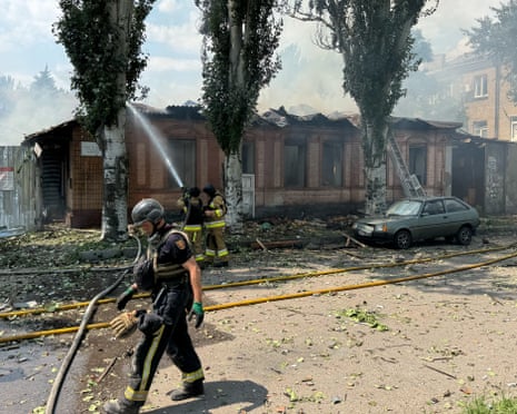 Rescue workers extinguish a fire at a private enterprise damaged in a Russian drone strike in Zaporizhzhia, Ukraine.