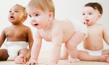 Babies playing together on floor<br>GettyImages-138307580