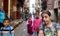 Syrian children pose for a photo on a narrow street in the Shatila Palestinian refugee camp on the southern outskirts of Beirut