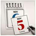 a hand holding a calendar page with ‘nov 5’ on it