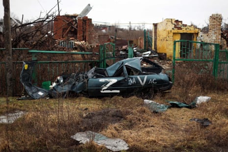 Destroyed buildings and a car as a result of shelling in the village of Kamenka, Kharkiv region