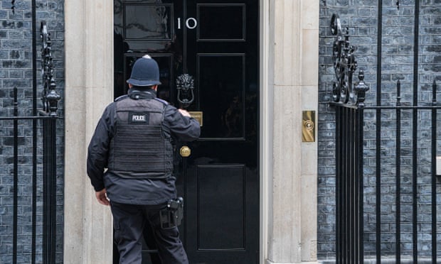 A police officer outside No 10.