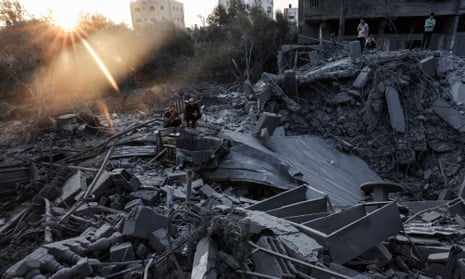 People inspect the damage to their home after Israeli strikes in the Rafah camp, southern Gaza