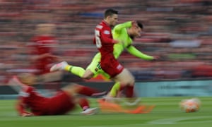Fabinho, on the turf, and Andrew Robertson combine to thwart Lionel Messi.