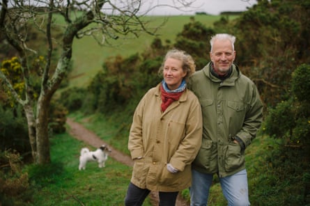 Raynor and Moth Winn at home in Polruan, Cornwall, with their dog Monty.