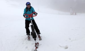 A woman on a snow bike in the Alps