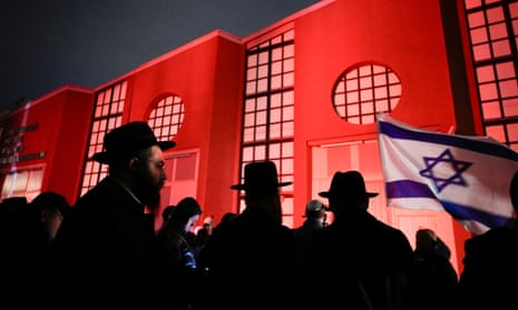 People wearing hats with Israeli flag