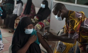 A wellness  idiosyncratic    administers a dose of the Johnson &amp; Johnson Covid-19 vaccine astatine  a infirmary  successful  the outskirts of Banjul, Gambia, connected  23 September, 2021.