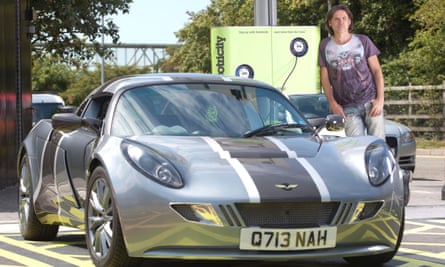 Dale Vince charging his eco car.