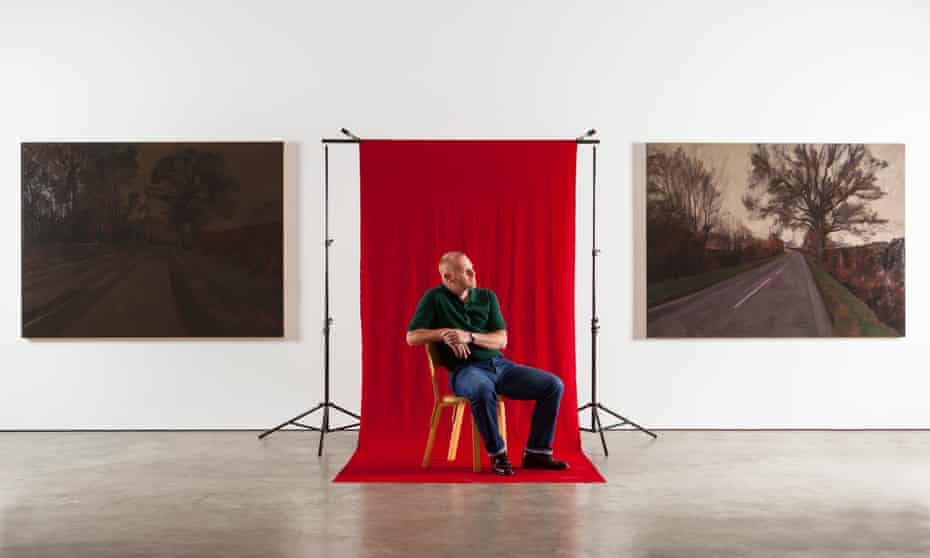 <strong>George Shaw photographed with his work at the Wilkinson Gallery in London