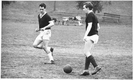Tony and Karl Miller playing football.