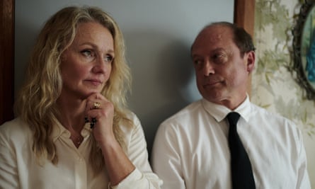 Rachael Blake and Alan Dukes leaning against a wall in a scene in Significant others. They are both wearing white shirts
