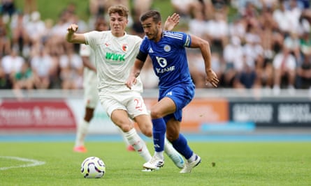 Harry Winks of Leicester City in action with Arne Engels of Augsburg during the pre-season friendly