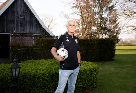Fred Rutten holding a football