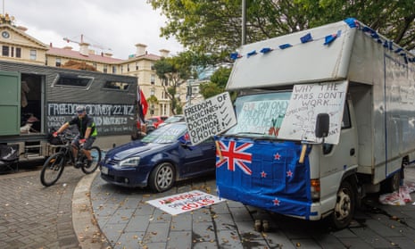 cars and vans parked outside new zealand's parliament