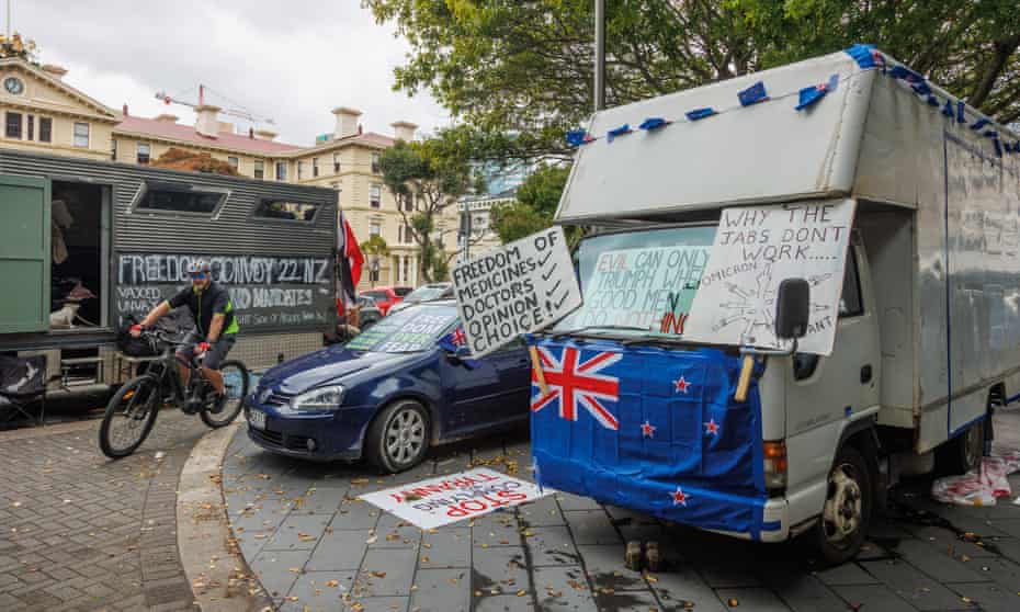 cars and vans parked outside new zealand's parliament