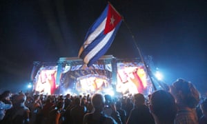 Fans wave the flag of Cuba at the Rolling Stones concert.