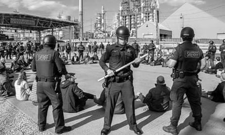 Police surround a climate change protest at the BP plant in Whiting, Indiana, on 15 May 2016.