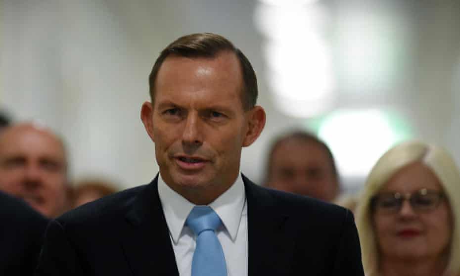 Australian Prime Minister Tony Abbott and fellow Liberal MPs arrive for a special Liberal party room meeting at Parliament House in Canberra.