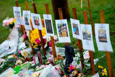 Rain soaked memorials for the victims of a mass shooting