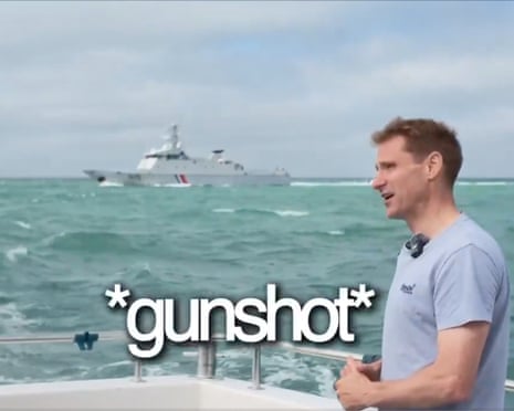 Philp on a boat with another boat visible in the distance