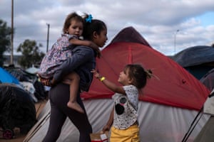 Children who hiked for a month in Central America and Mexico in a temporary shelter in Tijuana.