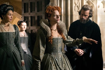 Gemma Chan, Margot Robbie and Guy Pearce in Mary Queen of Scots.