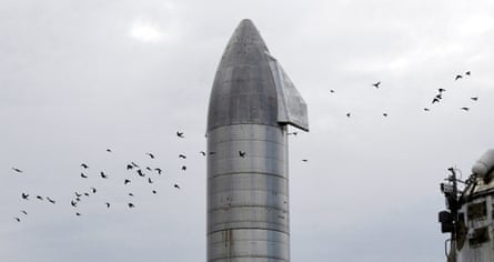 Birds pass over SpaceX’s Starship SN8 on 4 December, days before a test launch in Boca Chica, Texas.