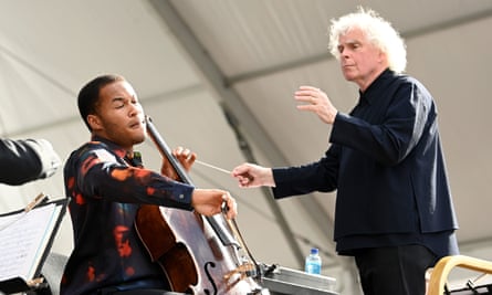 Simon Rattle conducting the cellist Sheku Kanneh-Mason and the London Symphony Orchestra in June 2022.