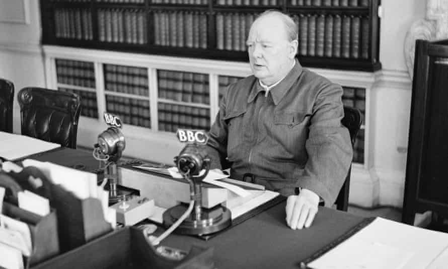 Winston Churchill makes a radio address from his desk at 10 Downing Street, 1942.