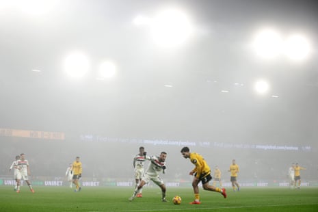 Rayan Aït-Nouri of Wolves runs with the ball while under pressure from Noussair Mazraoui of Manchester United during the home side’s 2-0 victory at Molineux