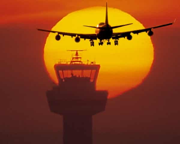 Airplane in the sky above the airport