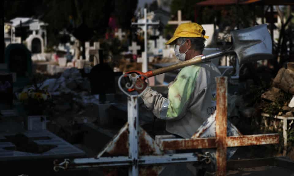 A gravedigger works at the San Nicolás Tolentino Pantheon, as the cemetery makes space for more burials amid the Covid-19 pandemic in the Iztapalapa area of Mexico City on Wednesday.