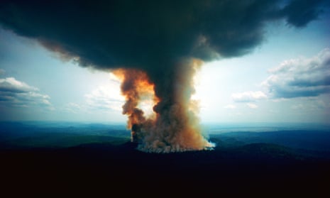 Towering rain forest fire at Jari Forestal, Para, Brazil.