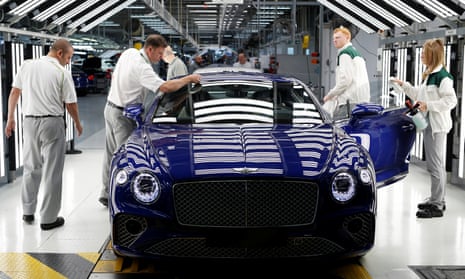 Workers inspect a Bentley Continental GT at the luxury automaker’s manufacturing facility in Crewe before the coronavirus lockdowns forced production to cease.