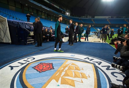 Lionel Messi arrives for his team’s training session at the City of Manchester Stadium.