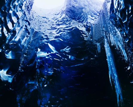 Ice Cave, Vatnajökull, 2014. Conceptual documentary photographer Richard Mosse used a large-format plate-film camera and infrared film to photograph the ice cave under the Vatnajökull glacier in Iceland. Glacier caves usually form when air enters where water flows underneath the ice, the warm air slowly creates melting and forms a cave from beneath. The dynamic process is becoming more unpredictable as the weather changes and cave access may become impossible in the future.