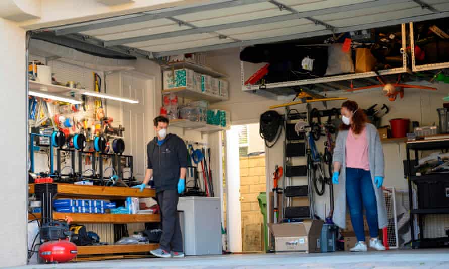 A husband and wife making protective visors with 3D printers in their home garage in Calabasas, California.