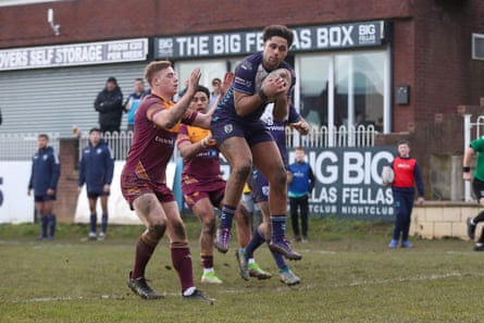 Featherstone’s Derrell Olpherts catches a high ball in a friendly against Huddersfield Giants in February 2025