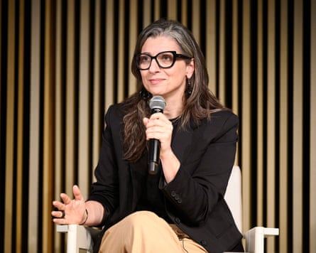 Francesca Albanese holding a microphone