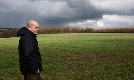 Dark clouds behind Matt Culley, a crop farmer, in Hampshire